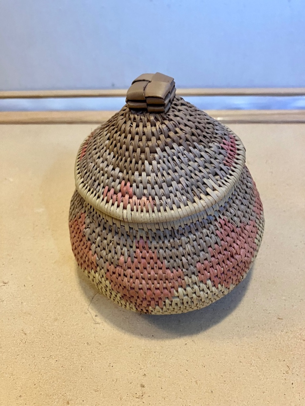 Multicolored Small hand-woven basket with lid